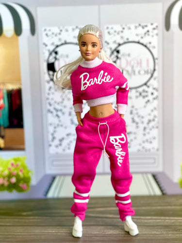 Pink sweatpants and sweatshirt for Barbie doll with logo