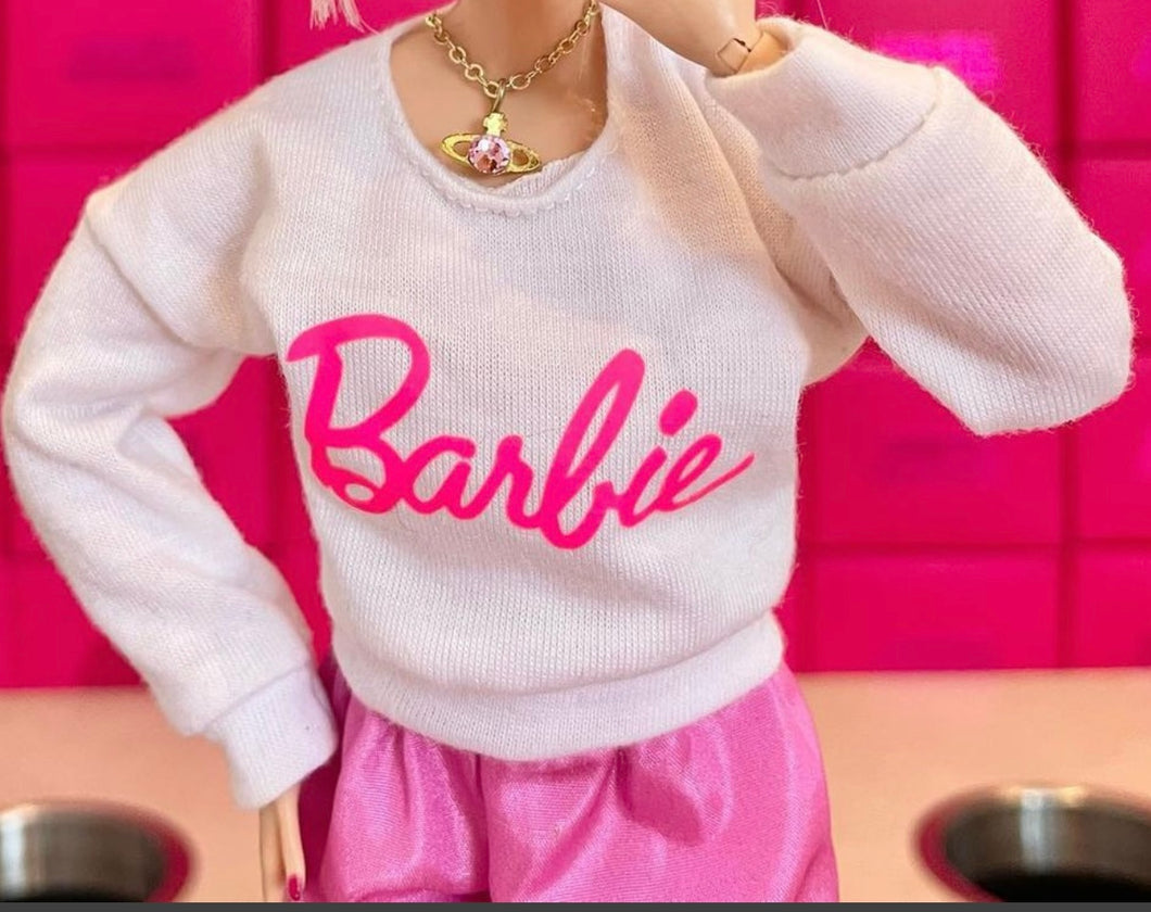 White sweater with pink logo for fashion dolls